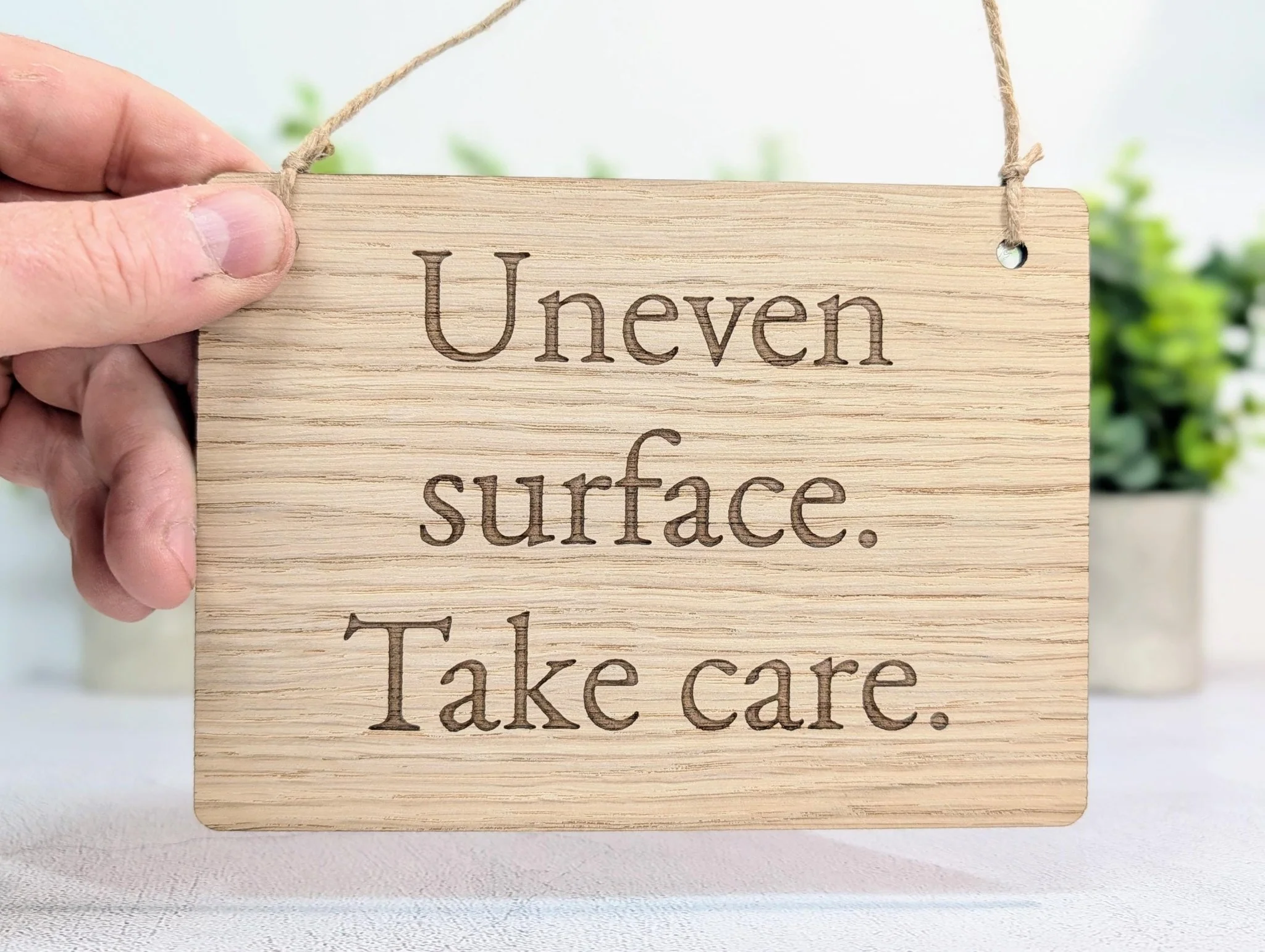 Uneven Surface Take Care Sign – Oak Veneered Wooden Hanging Sign, Personalised Text Option, Handmade in Wales, Eco Packaging - 4 Sizes